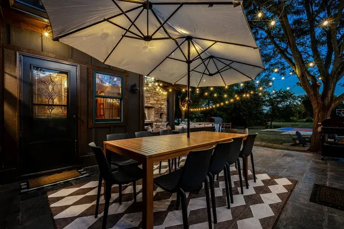 Enjoy your dinner set in this beautiful outdoor dining area with fairy lights and scenic view.