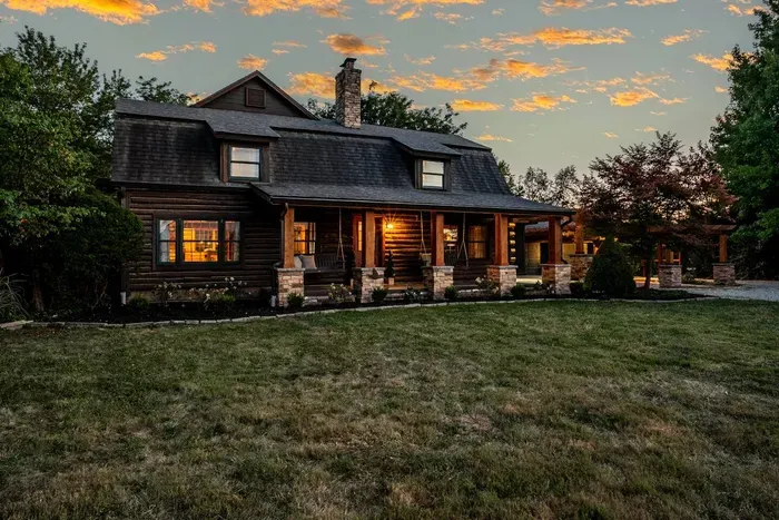 Peaceful front yard—beautifully set against a golden sunset sky.
