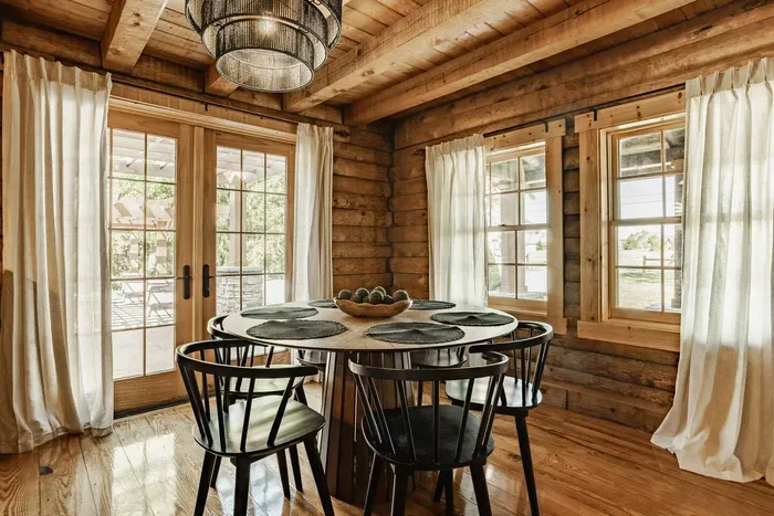 Bright dining area with access to the outdoors.