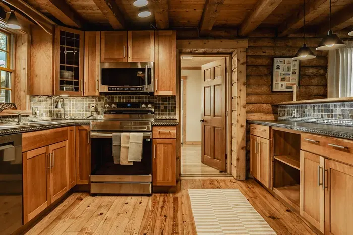 Open, functional layout with seamless flow between cooking, prep, and dining areas—warm, inviting, and easy to navigate.