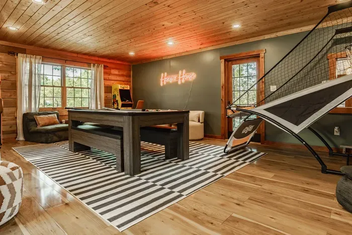 Stylish entertainment room offering a lively space to unwind and play.