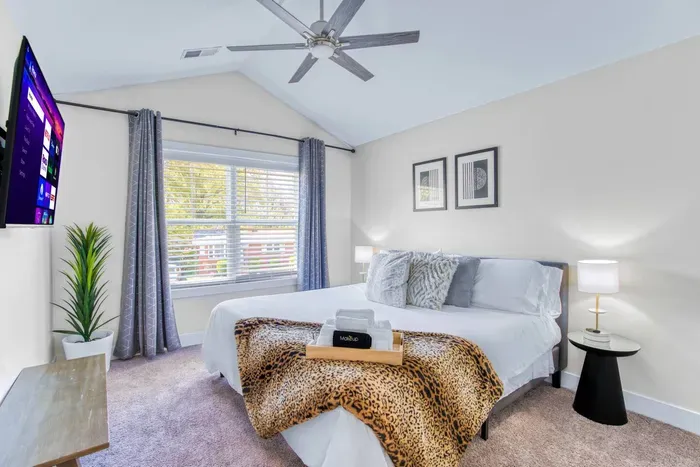 Relax in this bright, stylish room with a king-size bed, smart TV, soft lighting, and large window views. Perfect for a restful and comfortable stay.