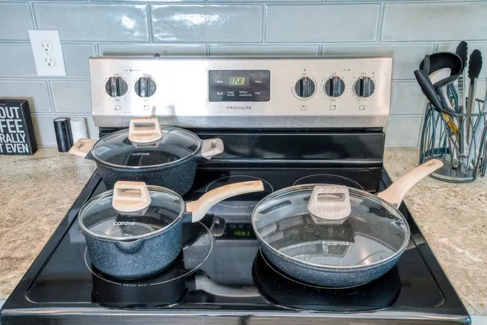 Fully stocked kitchen with quality cookware and utensils—ready for your favorite home-cooked meals.