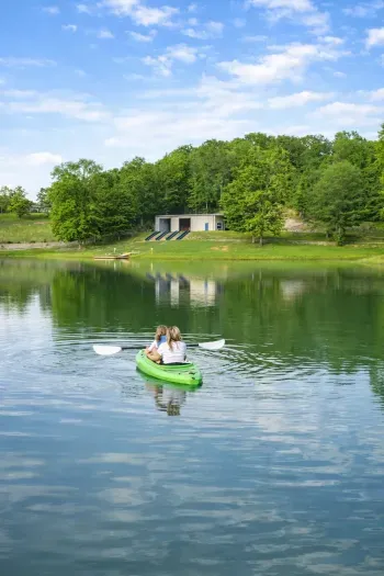 Serene lakefront escape with kayaks, boathouse, and peaceful forest views