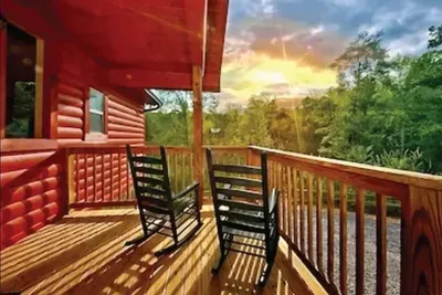 Covered deck with rocking chairs at the Sevierville Tennessee barnhouse
