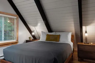 A plush queen mattress and high end sheets make for a good night's rest. The view of the surrounding woods and the skylight above make it that much better. :)