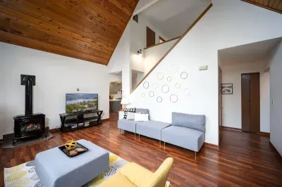 This spacious living room has plenty of seating for all of your people. :)