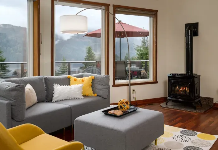 The views from this spacious living room with the cozy, gas fireplace are stunning and the perfect place to unwind after a long day of hiking, skiing, mt biking, or exploring the beautiful Bellingham area. :)