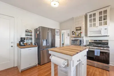 A bright and functional kitchen ready for coffee and home-cooked meals.