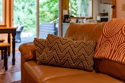 Cozy couch, plush pillows and fluffy blankets in front of a fire? What's not to like!