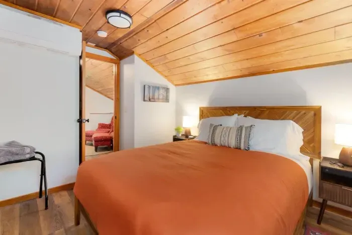 The bedroom with a river view! Love this cozy bedroom that has a queen bed with a memory foam mattress for your comfort. :) The view is a big bonus!