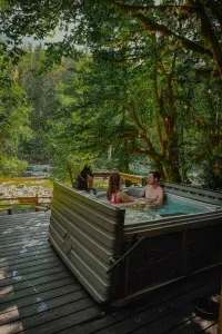 Hot tub with your honey overlooking the river...what's not to love? Oh, and your sweet pup is always welcome. Just not in the tub. :D