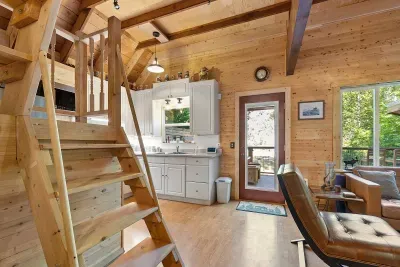 Ship ladder style steps to the sleeping loft.