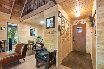 The front door and entry way lead to the open-concept  kitchen/living room.