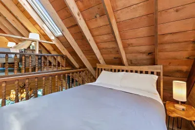 Plush Queen bed on the lower, loft level.