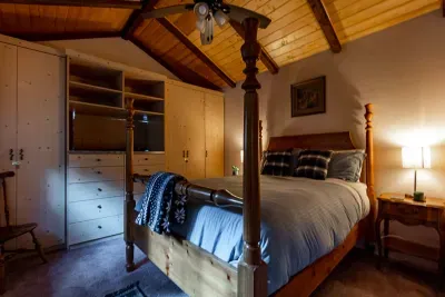 The 4-poster queen bed on the main floor is so comfy!