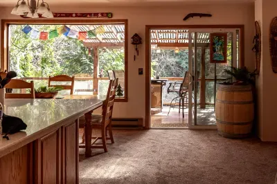 This kitchen and eating area is huge and has plenty of room for your people, whether inside or out on the deck. 