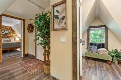 Upstairs you'll find the cutest half-bath and both bedrooms. :) The Bird Room on the right and The Mushroom Room is on the right. You have a picture-perfect view of the river from both bedrooms. 
