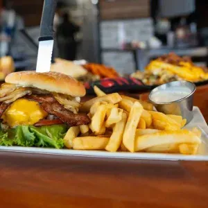 The Buzz Inn is the place to be for good pub fare, local vibe, games on the big screen, or Trivia on Wednesday nights. Oh, and you can order breakfast all day. :)