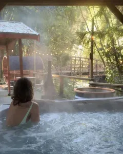 Spring fed hot tub with Rusty bridge and river view