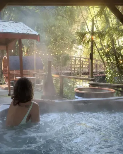 Spring fed hot tub with Rusty bridge and river view