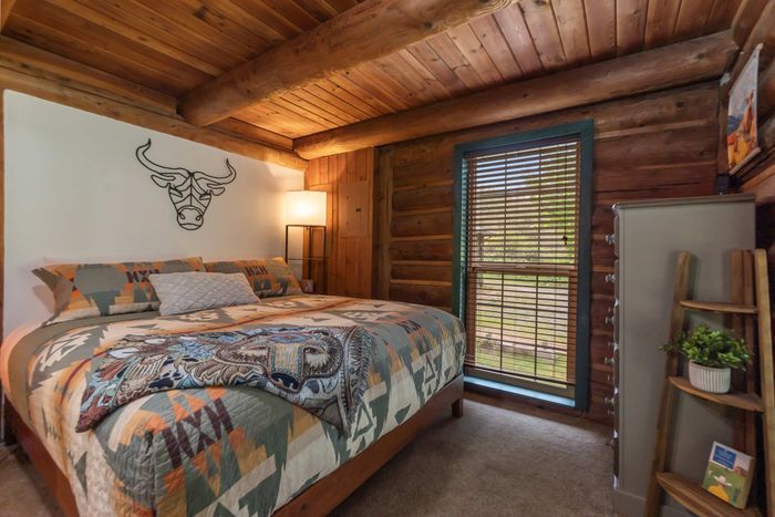 This cozy, main-level bedroom boasts a king-size bed with high-end linens and a beautiful Pendleton quilt.  You won't be roughing it in this cabin. :)