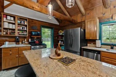 The kitchen has a huge island, so gather your people and enjoy. :)