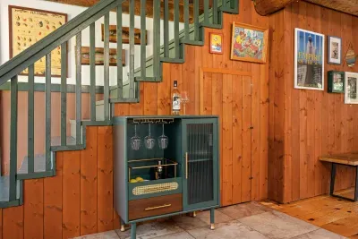 The staircase leads to the loft, with a cozy Queen sized private suite.