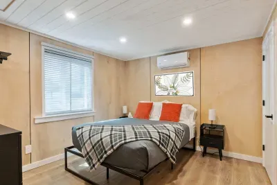 Main-floor bedroom has a comfy queen bed with high-end linens.