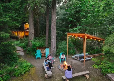 Firepit with a covered picnic table. Dinners by the river are a must. :)