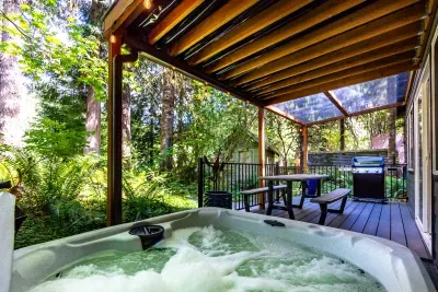 Enjoy a hot soak under the canopy of trees while listening to the rushing river.