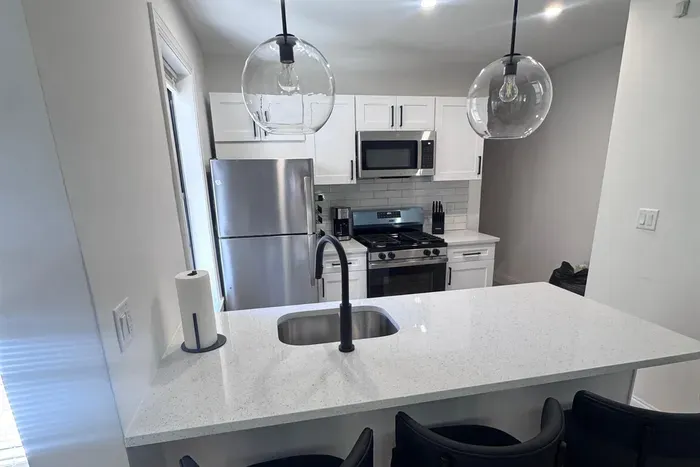 Brand new kitchen with stainless steel appliances