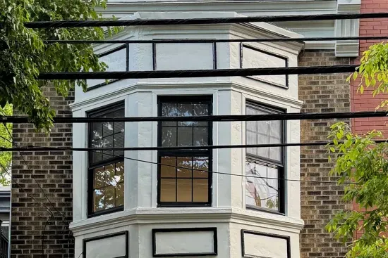 Neoclassical victorian Rowhouse on a treelined street. fully remodeled inside