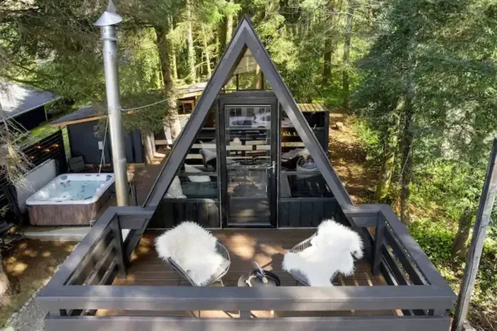 Upstairs deck has an ocean view. Great for Sunsets from our cozy A-frame.