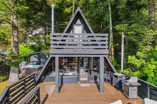 Welcome to Falcon Cove Retreat, a tranquil getaway tucked into the trees just steps from the Pacific Ocean.