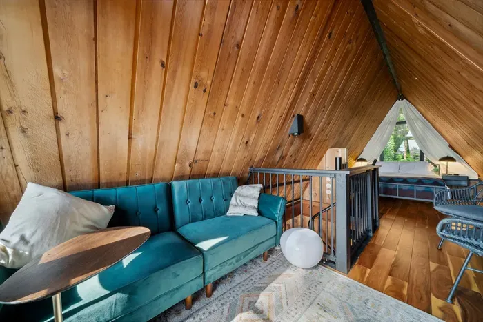 Surrounded by trees and styled with comfort in mind—this living space invites you to stay awhile.
