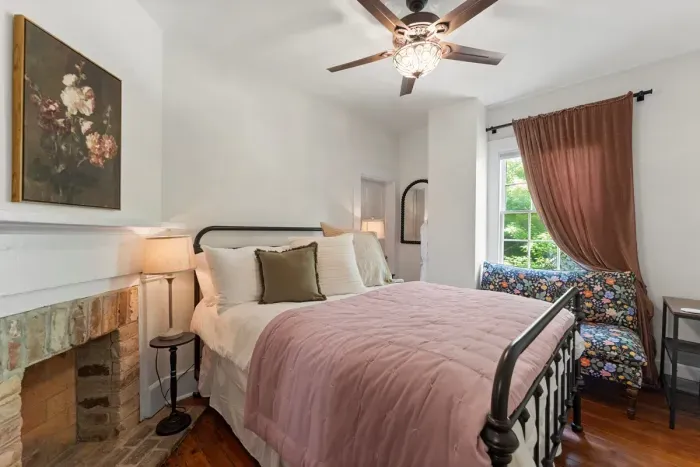 The second bedroom offers a welcoming queen bed and a seating area.