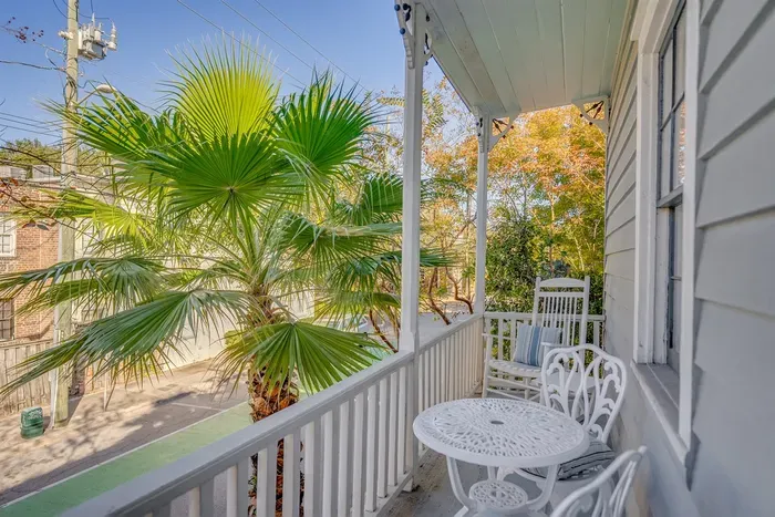 Our upper porch/balcony is accessible from the upstairs landing and connects both duplexes.  A lovely space to relax and soak in the ambiance of Savannah.