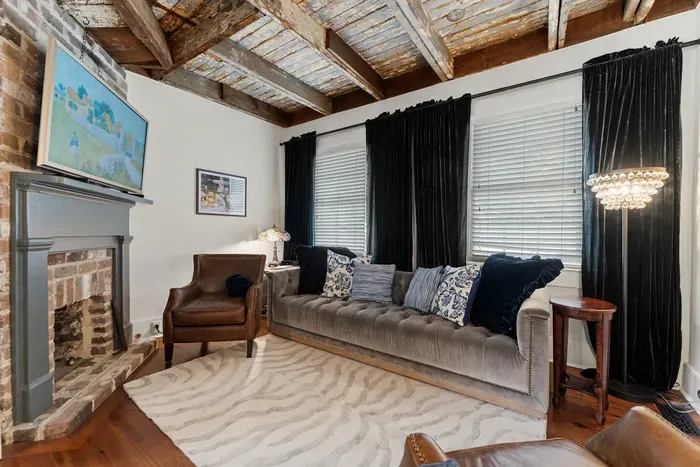 Our inviting living room offers a cozy place to relax, with plush seating and curated touches that make it feel like home.