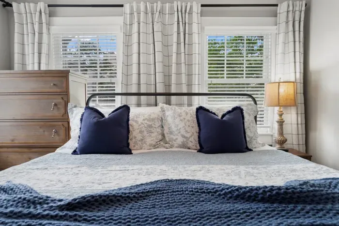 Sink into our plush king bed and let the day melt away—comfort meets quiet in this private escape.