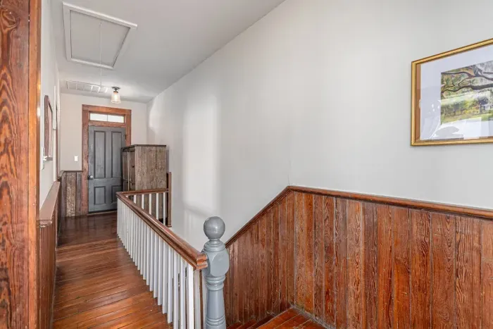 Upstairs Hallway leads to our outdoor balcony There is a lovely armoire for hanging clothing if needed.