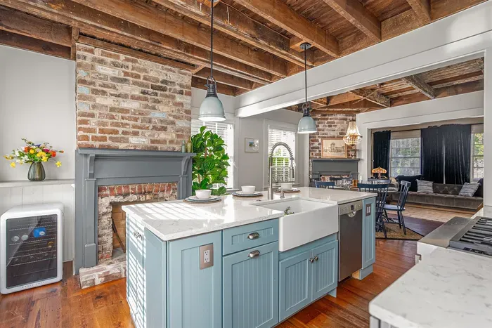 The kitchen includes an extra beverage fridge, ensuring plenty of space for guests to store their favorite drinks.