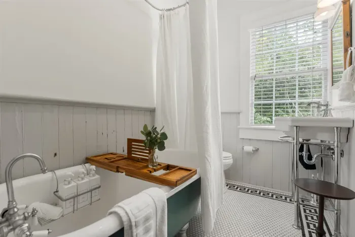 Freshen up in style—this bathroom blends comfort and function with a touch of charm.