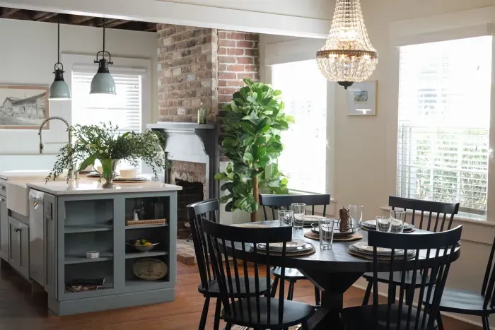 The stunning dining area, just off the kitchen, flows seamlessly into the living space and offers comfortable seating for six—a perfect spot for shared meals and conversation.