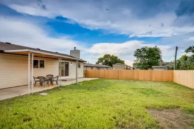 Fully fenced-in, private backyard: A patio table that seats six people. Additional outside chairs, sled, snow shovel. Electric Grill and grilling utensils.