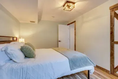 Downstairs sage room- behind the secret door: Queen Bed. Outlets, USB ports, and charging stations are located on the headboard. The headboard has LED lights that can be turned on via the remote located on the headboard. There are 20 color options.