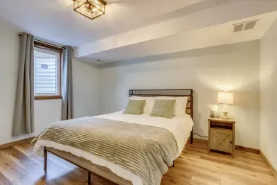 Downstairs sage room- behind the secret door: Queen Bed. Outlets, USB ports, and charging stations are located on the headboard. The headboard has LED lights that can be turned on via the remote located on the headboard. There are 20 color options.
