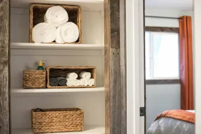 Extra supplies for your stay. We have your back if you forgot a toothbrush, toothpaste, or hair dryer! There are extra towels in this closet as well. The grey towels are for the removal of makeup.