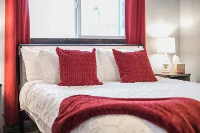 Master bedroom: Queen Tempurpedic mattress. Room darkening shades. White 100% cotton bedding.
