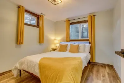 Cheery bedroom and office- behind the secret door: Queen Bed. Outlet charging stations are located on the headboard. The headboard has LED lights that can be turned on via the remote located on the headboard. There are 20 color options.